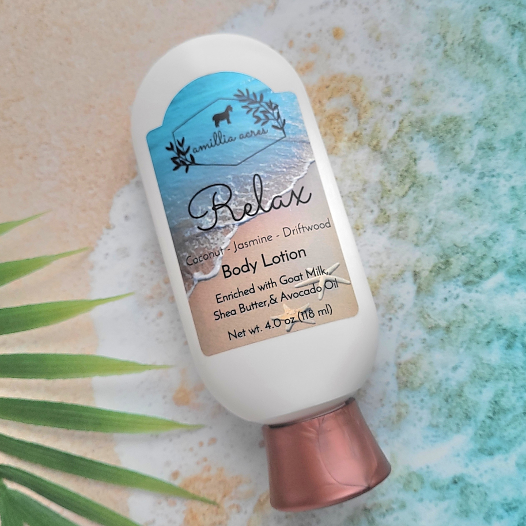 A bottle of body lotion labeled "Relax" with a design featuring a beach scene. The label mentions coconut, jasmine, driftwood scent and ingredients like goat milk, shea butter, and avocado oil. The bottle is set against a textured background with a leaf.