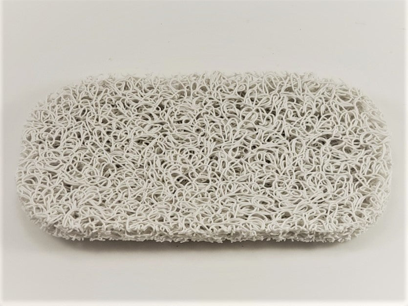 The Soap Saver by Amillia Acres is a rectangular scrubbing sponge featuring a textured, curly surface to prolong the lifespan of your soap, displayed on a plain white background.