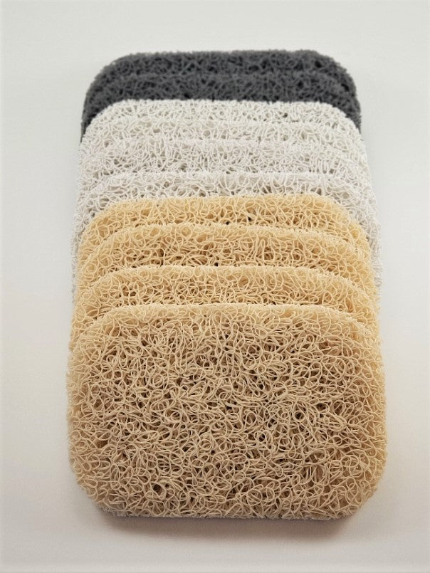 A set of six loofahs, marketed as Soap Savers by Amillia Acres, is displayed vertically with three beige layers at the base and three darker ones above. Their textured, curly design creates a layered look against a light backdrop, aiding in prolonging your soap's longevity.