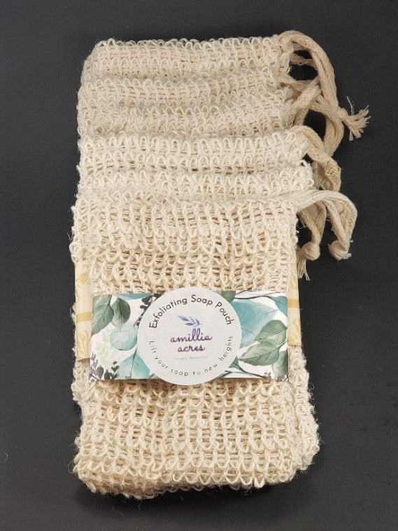 A set of four Exfoliating Soap Saver Bags made from natural sisal, each equipped with a drawstring. These pouches provide gentle exfoliation, and the packaging displays a label with the Amillia Acres brand on a dark background.