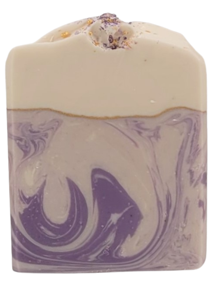 The Grace goat milk soap by Amillia Acres features a creamy beige top and a marbled purple-and-white base. Its textured top, adorned with small chunks and specks, creates an artisanal look, enriched with natural oils for a luxurious feel.