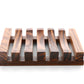 The Amillia Acres Wooden Soap Lift features parallel slats and a rectangular design that lets water drain, keeping your soap dry. Photographed against a white background.