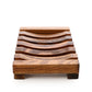 The Amillia Acres Wooden Soap Lift features a slatted, curved design with raised edges; this natural wood soap saver is shown on a white background.