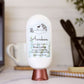 An Amillia Acres Awaken Goat Milk Lotion sits on a desk near a laptop and notebook, its label highlighting nourishing goat milk, shea butter, and avocado oil.