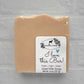 A luxurious bar of handmade beige goat milk soap, with a wavy top edge, rests on a white background. The label reads: "I love this Bar! Fresh - Calm - Clean," features a charming branch and goat illustration, and lists "Net wt. 4 oz (127 g)". Produced by Amillia Acres ~ Goat Milk Soaps and Lotions.